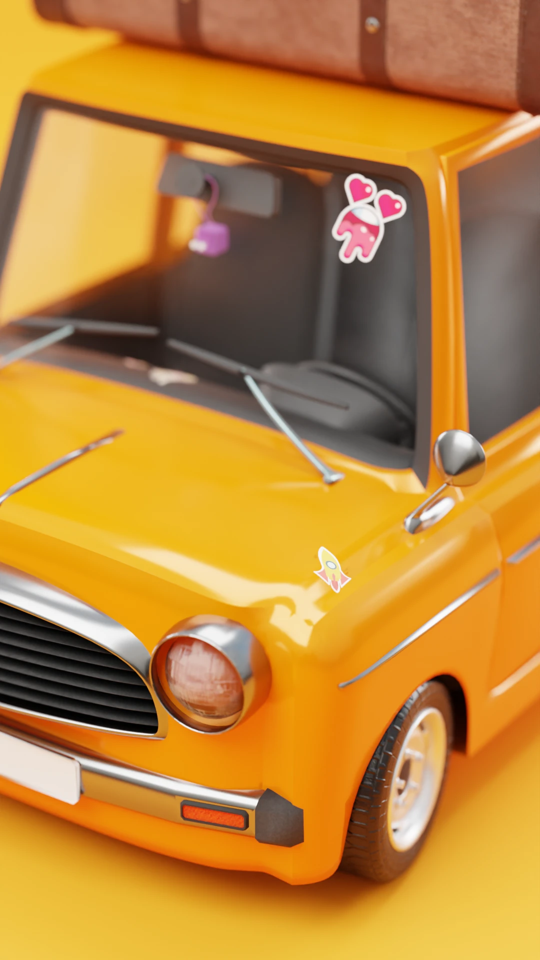 Close-up of the car's front seat window with a hanging air freshener and character sticker